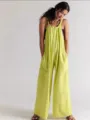 Lime green loose fit overall jumpsuit detail view featuring adjustable straps and pockets. - S / Lemon Yellow