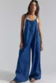 Casual loose blue denim jumpsuit with straps, comfortable wide leg design for daily wear. - Dark Blue