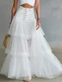 Detail shot of women's denim and tulle spliced tiered maxi skirt with high waist. - S / White