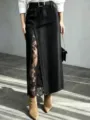 Black denim midi skirt featuring high waist, front split, and elegant black lace trim. - S / Black