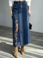 Detail shot of high waist washed denim maxi skirt featuring elegant lace slit edging. - S / Dark Blue