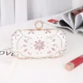 Elegant white evening clutch bag with sparkling pink rhinestones and a unique ring clasp. - Silver