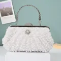 Elegant pearl beaded evening clutch bag with metallic handle and rhinestone clasp for women. - White