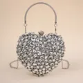 Exquisite crystal rhinestone details on this heart evening bag showcase luxury and elegance. - L / Silver