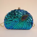 Close-up detail of the stunning sequin beaded peacock evening clutch bag with gold chain. - 23*5*15cm / Navy Blue Round Bead Single Buckle