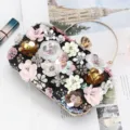 Elegant black evening clutch bag with 3D floral bead embroidery and golden metal handle for parties. - Black