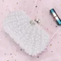 Elegant white pearl beaded evening clutch bag for women, sparkling rhinestone clasp detail. - White