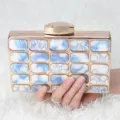 Elegant blue and white floral acrylic evening clutch bag with gold metal frame and secure clasp. - Blue and White Porcelain