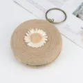 Round woven straw handbag with cute daisy flower decoration and metal ring handles for summer. - Khaki