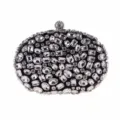 Elegant oval rhinestone evening clutch bag with sparkling crystals for luxury parties. - Black