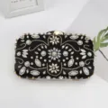 Elegant black satin evening clutch featuring sparkling rhinestones and delicate bead embroidery. - Black