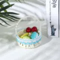 Pastoral small woven storage basket with blue lace trim and artificial fruit decor detail. - Blue Border