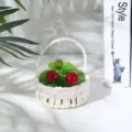 Detail shot of pastoral woven fruit basket with pink lace trim and artificial grapes cherries. - Pink Scalloped
