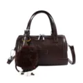 Dark brown leather Boston handbag for women, chic crossbody bag with fluffy pom-pom charm. - With Pendant / Coffee