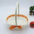 White woven storage basket with orange ribbon handle, perfect for floral arrangement or gift packing. - Oval Basket No. 4 (22*15*21cm) / Orange