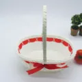 White woven basket with red ribbon and bow handle, ideal for floral gifts and egg storage. - Oval Basket No. 4 (22*15*21cm) / Red