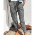Details of the grey leopard print casual pants featuring elastic drawstring waist and cuffed hem. - S / Gray