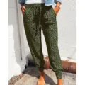 Detail shot of women's olive green leopard print casual pants with drawstring and cuffed hem. - S / Green