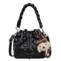Black quilted bucket bag with braided handle and cute dog charm for daily commute style. - With Pendant / Black