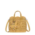 Borsa a secchiello in pelle gialla con motivi traforati e ciondolo a stella elegante. - Giallo
