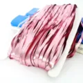 Metallic pink fringe curtain backdrop, perfect for birthday party and stage decoration layout. - Rose Gold