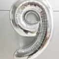 Large 40-inch silver number 9 foil balloon for birthday party and anniversary decorations. - 40 Inch Number 9 / Silver