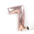 Rose gold 32-inch number 7 foil balloon, shiny metallic finish for birthday party decoration. - Number 7 / 32-inch / Rose Gold