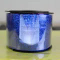 Detailed view of a blue laser ribbon roll, perfect for gift wrapping and balloon tying. - 100 Yards Laser Blue Ribbon (90m)