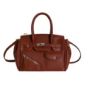 Brown leather handbag for women, stylish tote bag with top handle and classic lock design. - Brown