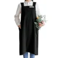 Détail de long tablier noir de style japonais, porté sur chemise, poches latérales profondes. - Noir