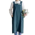 Detailed view of the dark green Japanese style linen apron, featuring big pockets. - Dark Cyan