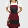 Canvas work apron with leather pockets and adjustable straps for woodworking and cooking. - Red