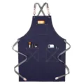 Dark blue canvas apron with grey cross straps and multi pockets, stylish kitchen workwear. - Webbing Thick Canvas Style E / Blue