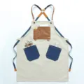 Retro canvas tool apron with multi-pockets and leather cross straps for barista and salon work. - Off White