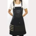 Black canvas work apron with leather pockets and straps, multi-pocket durable utility design. - Black 2