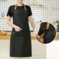 Black canvas apron with brown leather-style straps, perfect kitchen workwear for women, stylish. - Waterproof Canvas Halterneck Contrast - Black