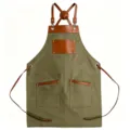 Durable canvas work apron with brown leather straps and multiple pockets for kitchen and BBQ use. - Green with Brown Leather Contrast