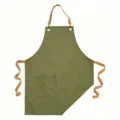 Grembiule in tela verde con bretelle marroni e tasca frontale, grembiule da cucina resistente. - Verde
