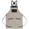 Canvas work apron with black leather straps and double pockets in khaki color variant - Light Gray with Black Leather Contrast