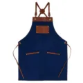 Blue canvas work apron with brown leather straps and pockets, stylish cafe BBQ cooking uniform. - Deep Blue with Brown Leather Contrast