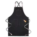 Black denim work apron with cross back straps and utility pockets for kitchen and barista. - Style C / Black