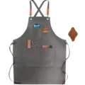 Detailed view of the thick canvas work apron pocket, showing reinforced leather and metal rivets. - Brown Leather & Black Gray