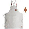 Durable canvas work apron with adjustable cross straps and utility tool pockets for daily use. - Brown Leather & Gray