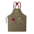 Durable vintage canvas work apron featuring leather cross straps and multiple utility pockets. - Round Badge Belt Canvas Army Green Style R