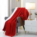 Detailed view of the cozy red and white double-sided flannel sofa blanket scene setup. - 120x150cm / Bright Red