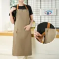 Khaki canvas work apron with adjustable straps and large front pocket for kitchen cooking. - Waterproof Canvas Halterneck Contrast - Dark Grey