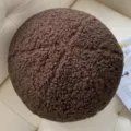 Close-up detail of dark brown teddy fleece round pillow, soft textured spherical cushion decor. - Diameter 30cm / Coffee