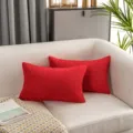 Red faux rabbit fur throw pillow, soft plush rectangular cushion for sofa and living room. - Red