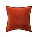 Close-up detail of the textured chenille throw pillow fabric, showing fine rust red weave. - Orange