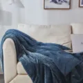 Cozy blue fleece throw blanket with braided texture displayed on sofa in a warm living room. - 150*200cm / Navy Blue